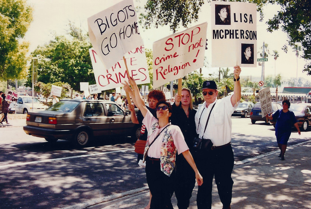 Scientologists try to hide Bob Minton's sign